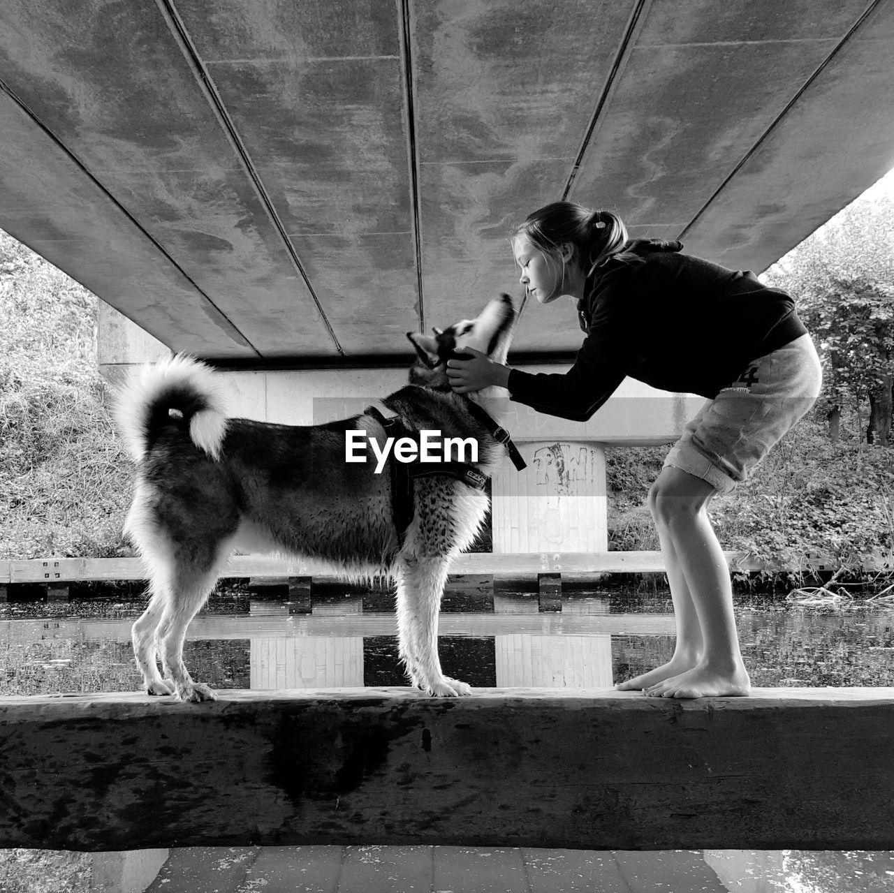 Girl with dog outdoors