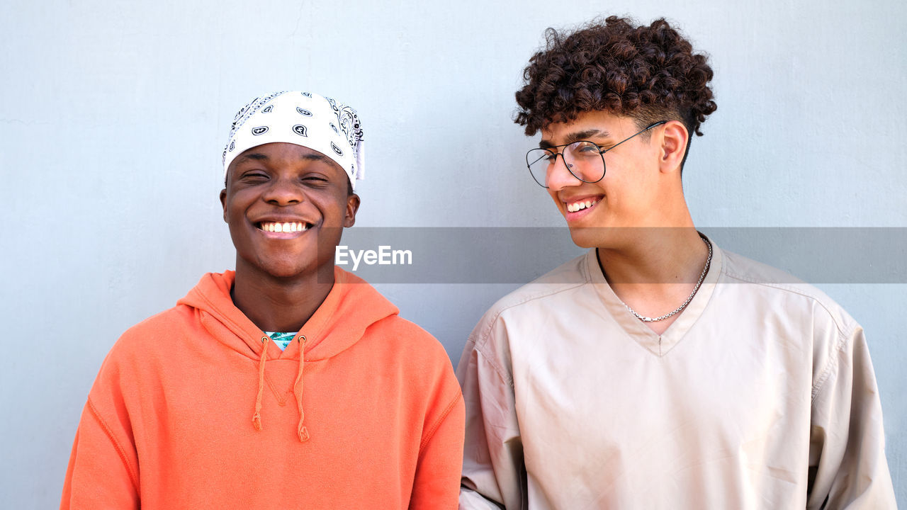 African black man and colombian man smiling