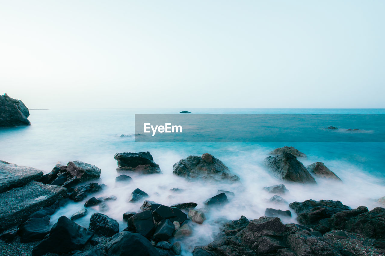 Scenic view of sea against clear sky