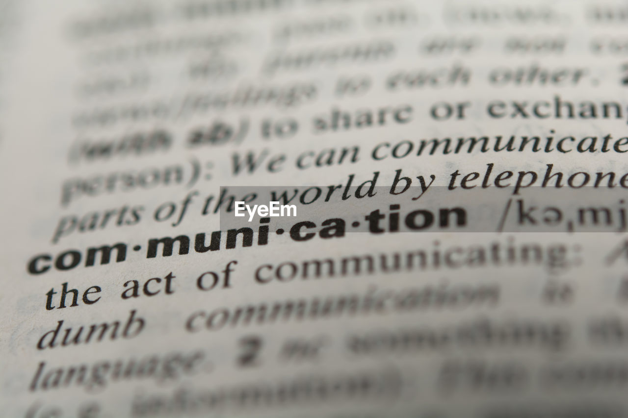 Close-up of communication text in dictionary