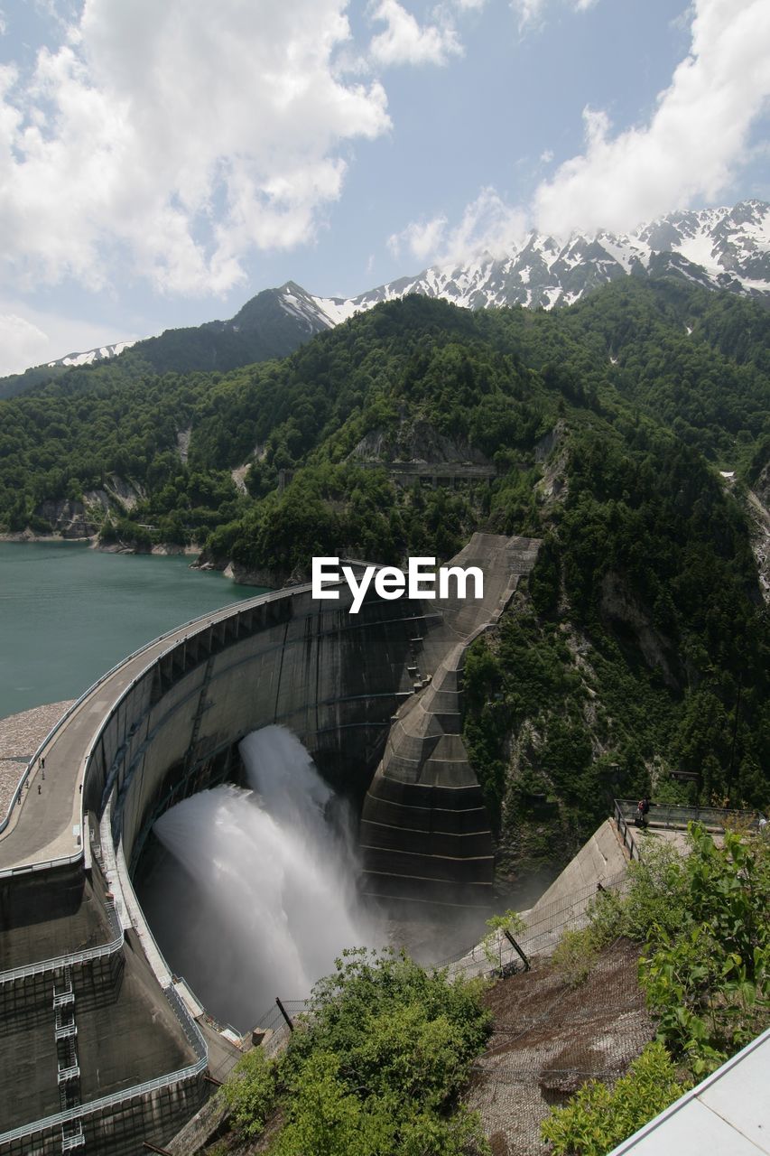 High angle view of dam on mountain against sky