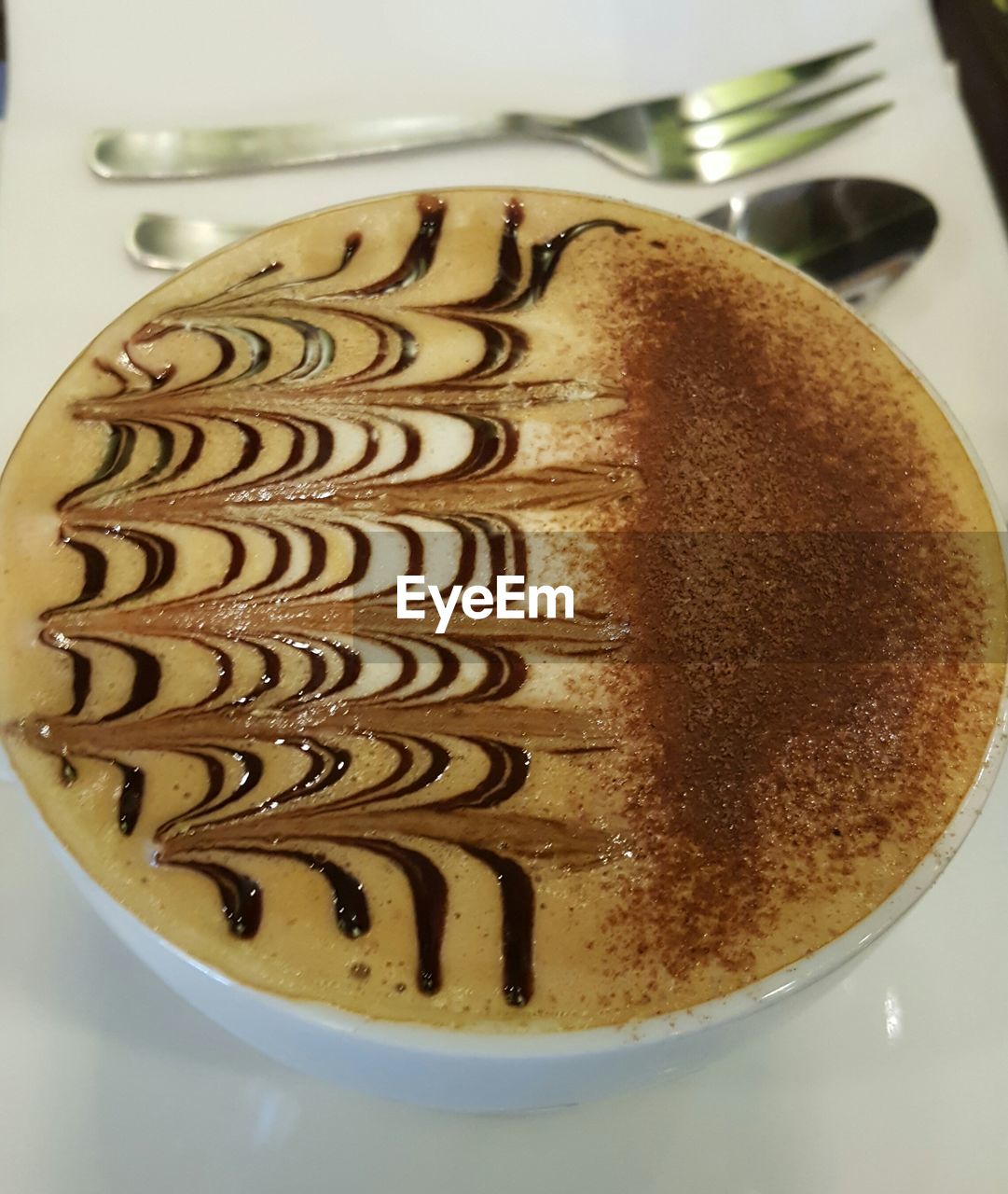 High angle view of cappuccino cup on table