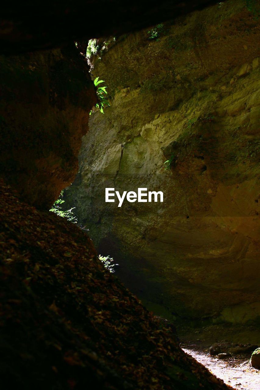 SCENIC VIEW OF CAVE AND MOUNTAIN