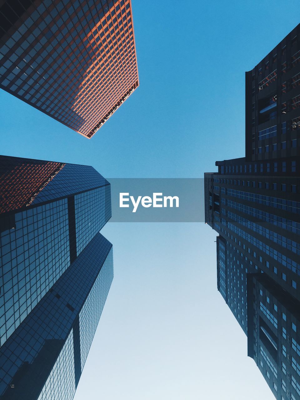 Low angle view of skyscrapers against clear sky