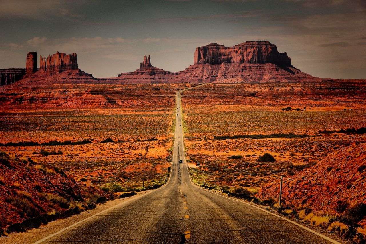 Asphalt empty country road along landscape