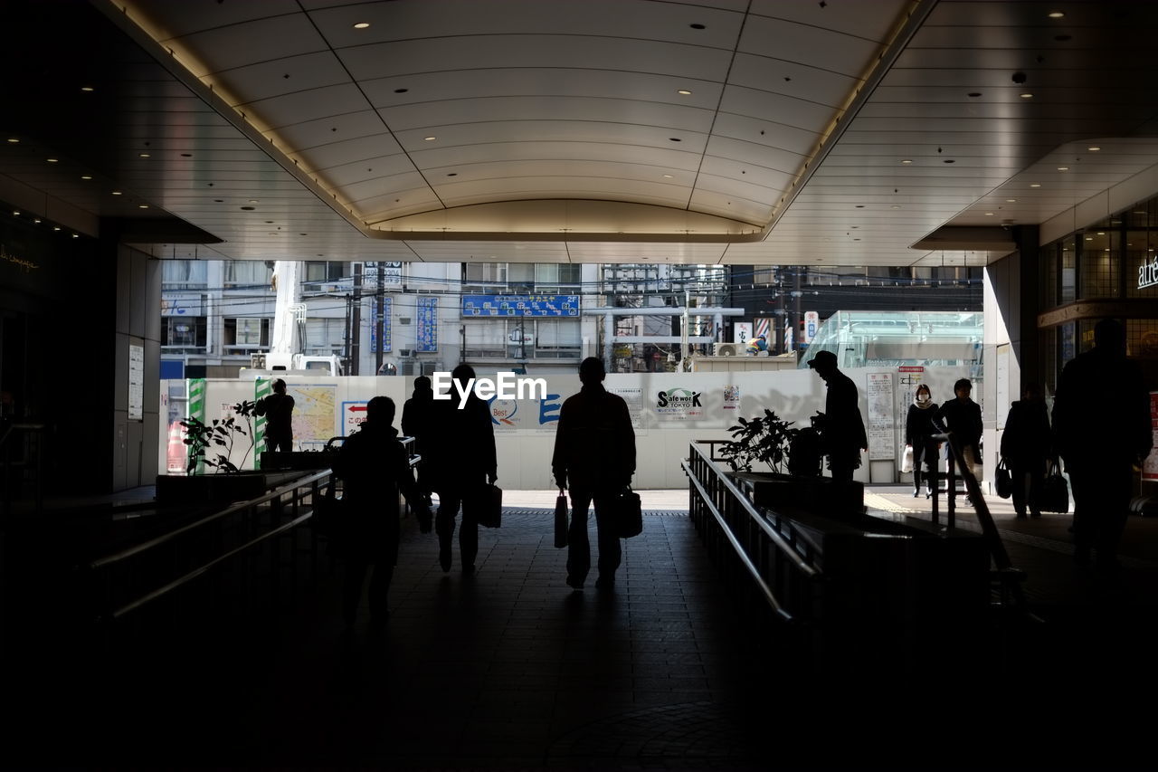 GROUP OF PEOPLE AT AIRPORT