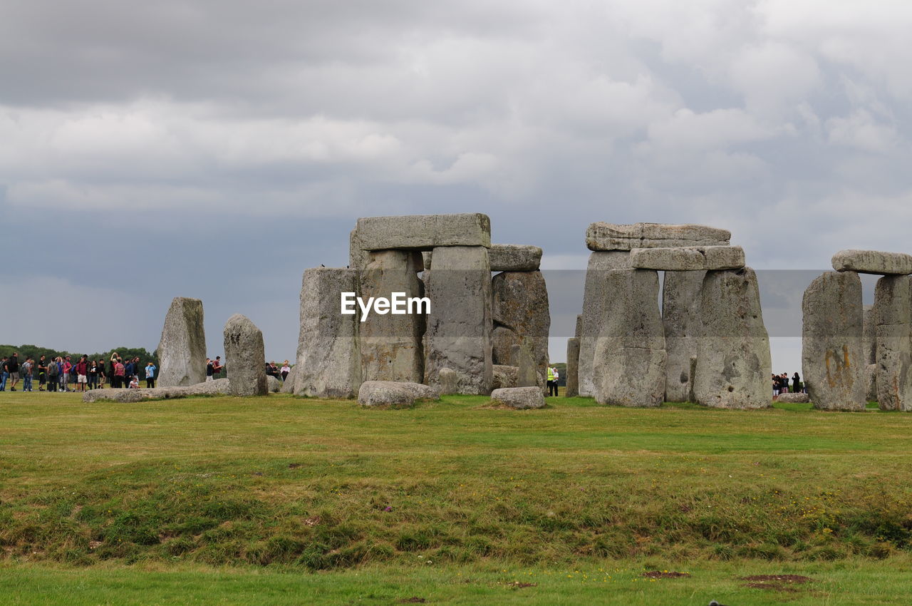 Built structure on landscape against the sky