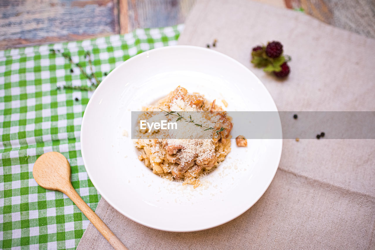 food and drink, food, kitchen utensil, dish, eating utensil, plate, freshness, produce, healthy eating, indoors, no people, high angle view, table, wellbeing, meal, breakfast, wood, dessert, spoon, sweet food, crockery, fork