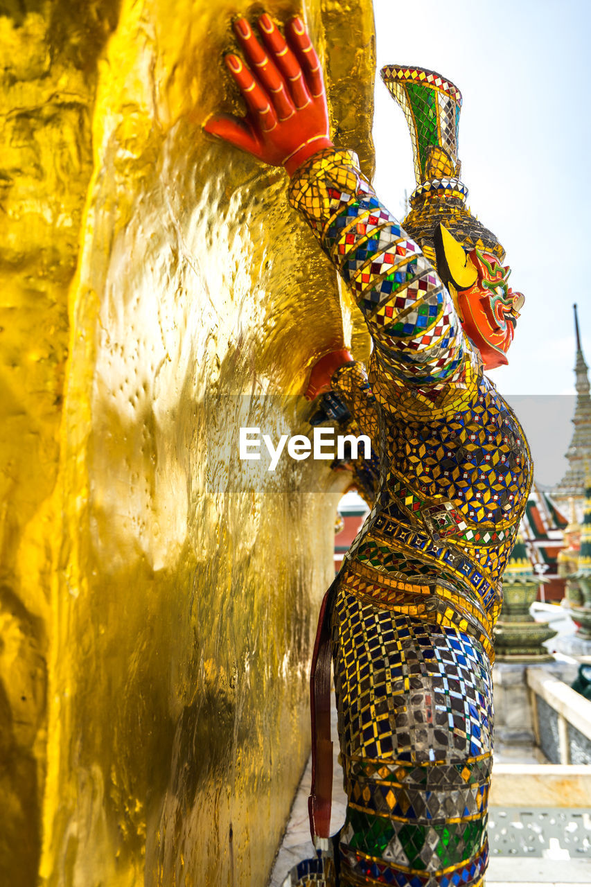 Close-up of monster sculpture at temple