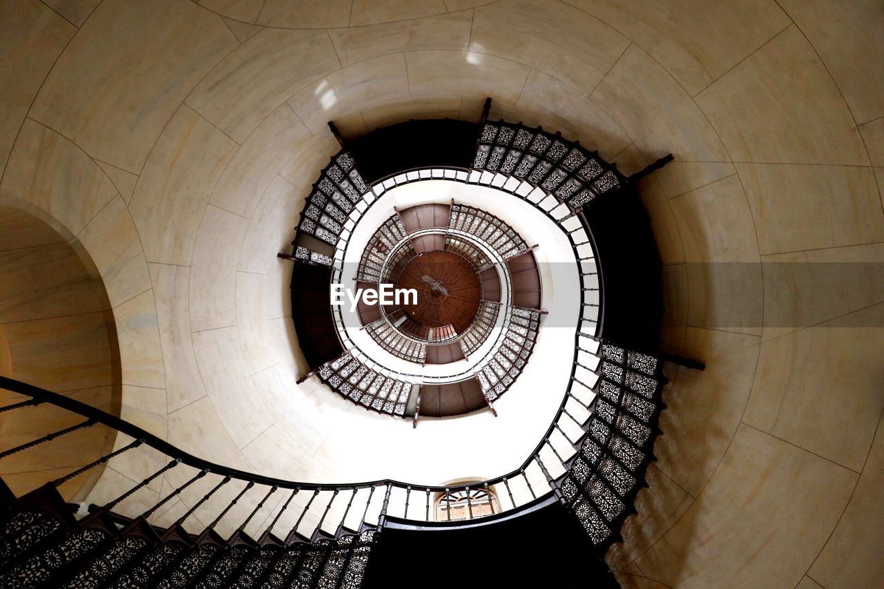 Directly below shot of spiral staircase in building