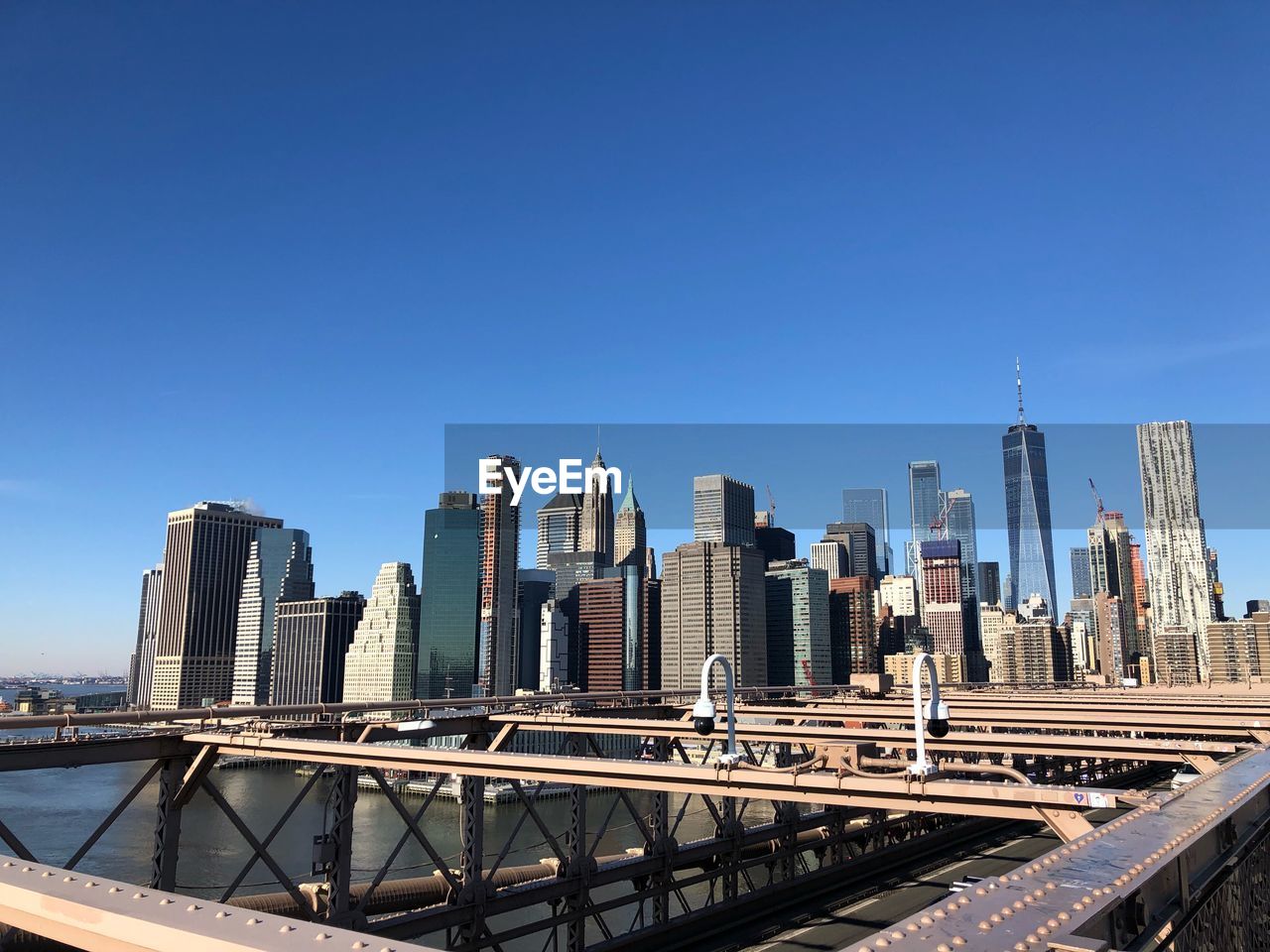 MODERN BUILDINGS AGAINST CLEAR BLUE SKY