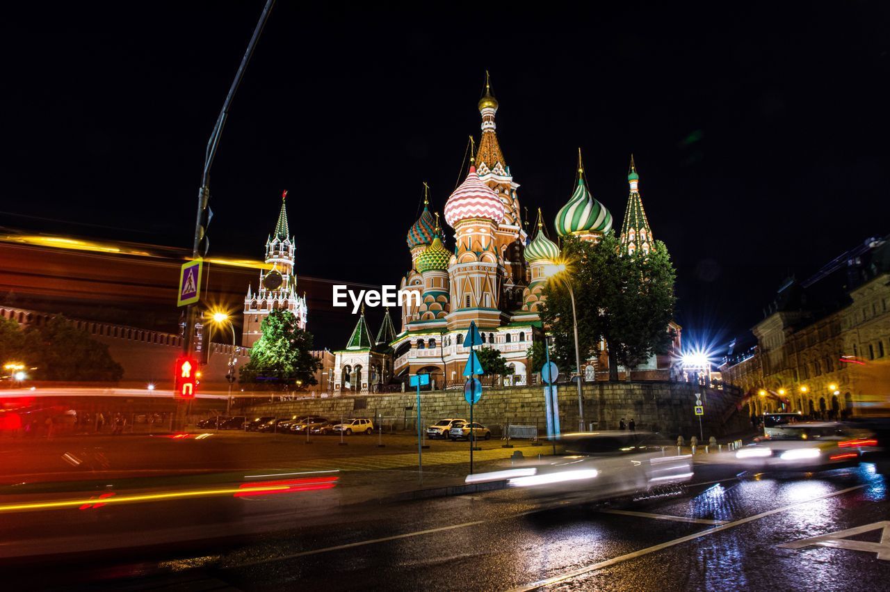 St basils cathedral by road in city at night