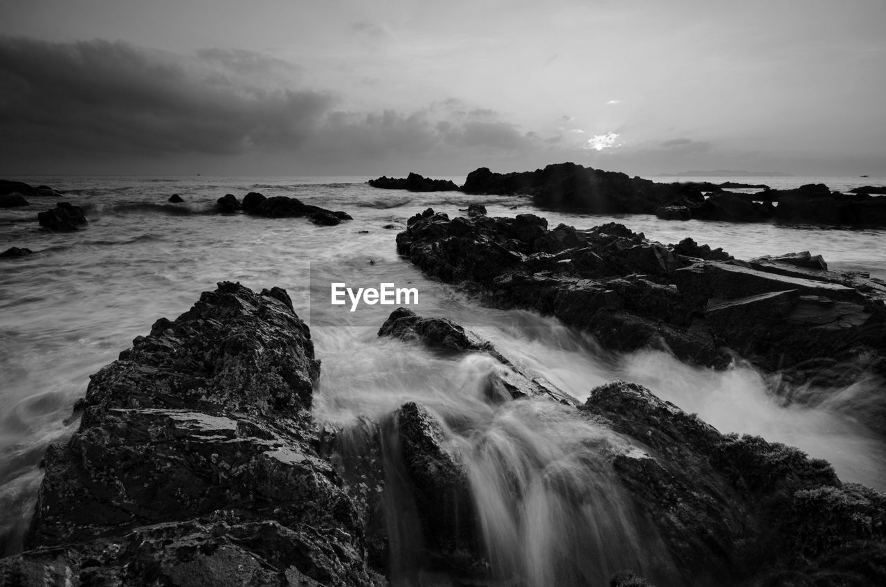 Scenic view of sea against sky at dusk