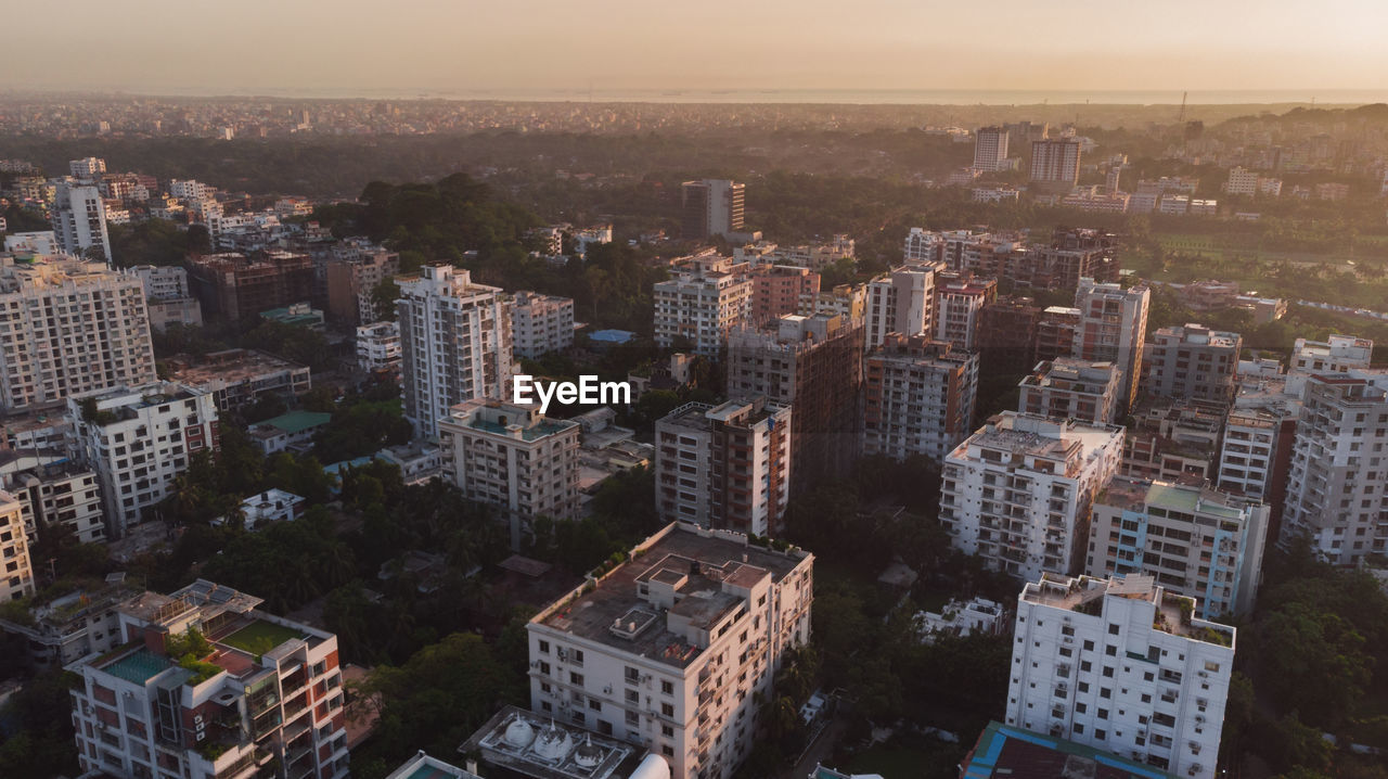 High angle view of buildings in city against sky