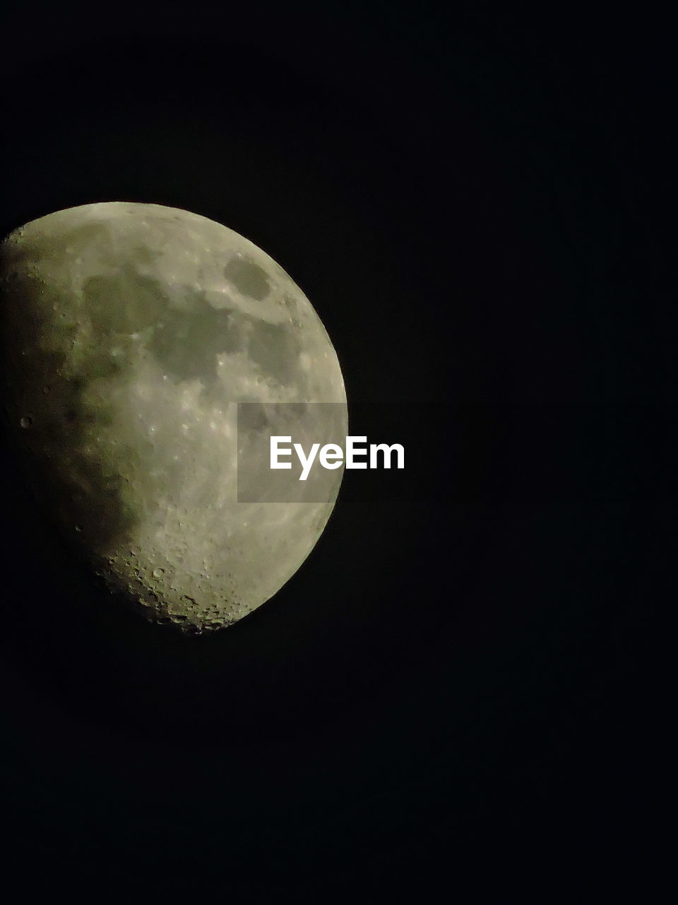 Low angle view of moon against clear sky at night