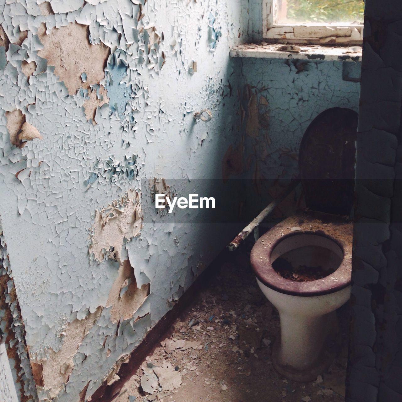 Decayed restrooms in abandoned building