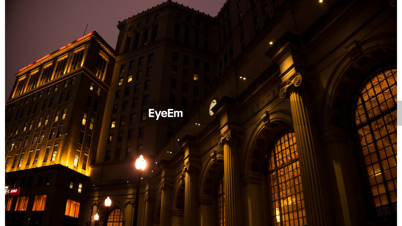 Low angle view of illuminated building at night