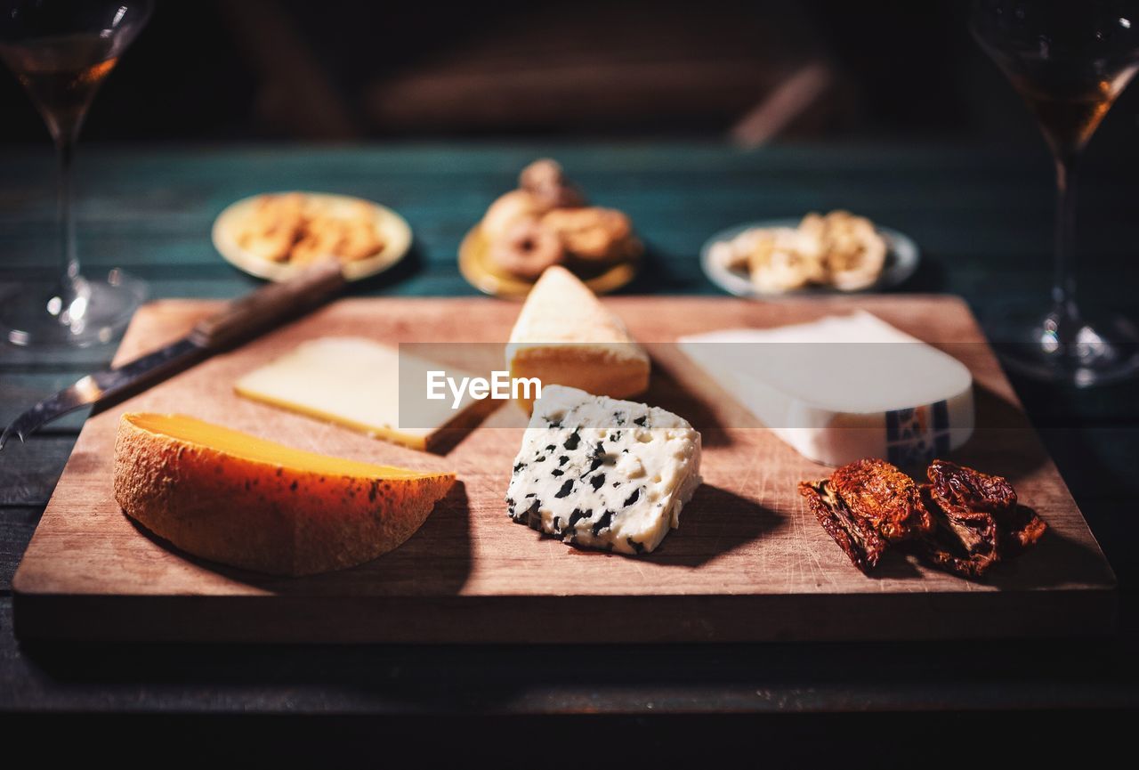 Close-up of cheese slices on chopping board