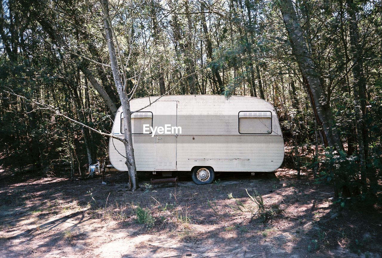 Abandoned caravan in forest