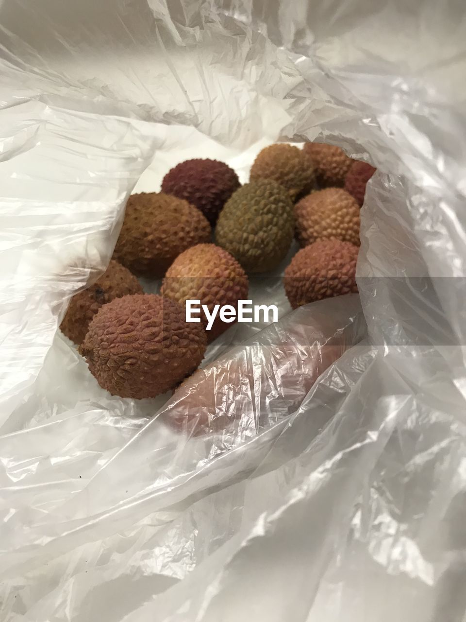 High angle view of litchi fruits in plate