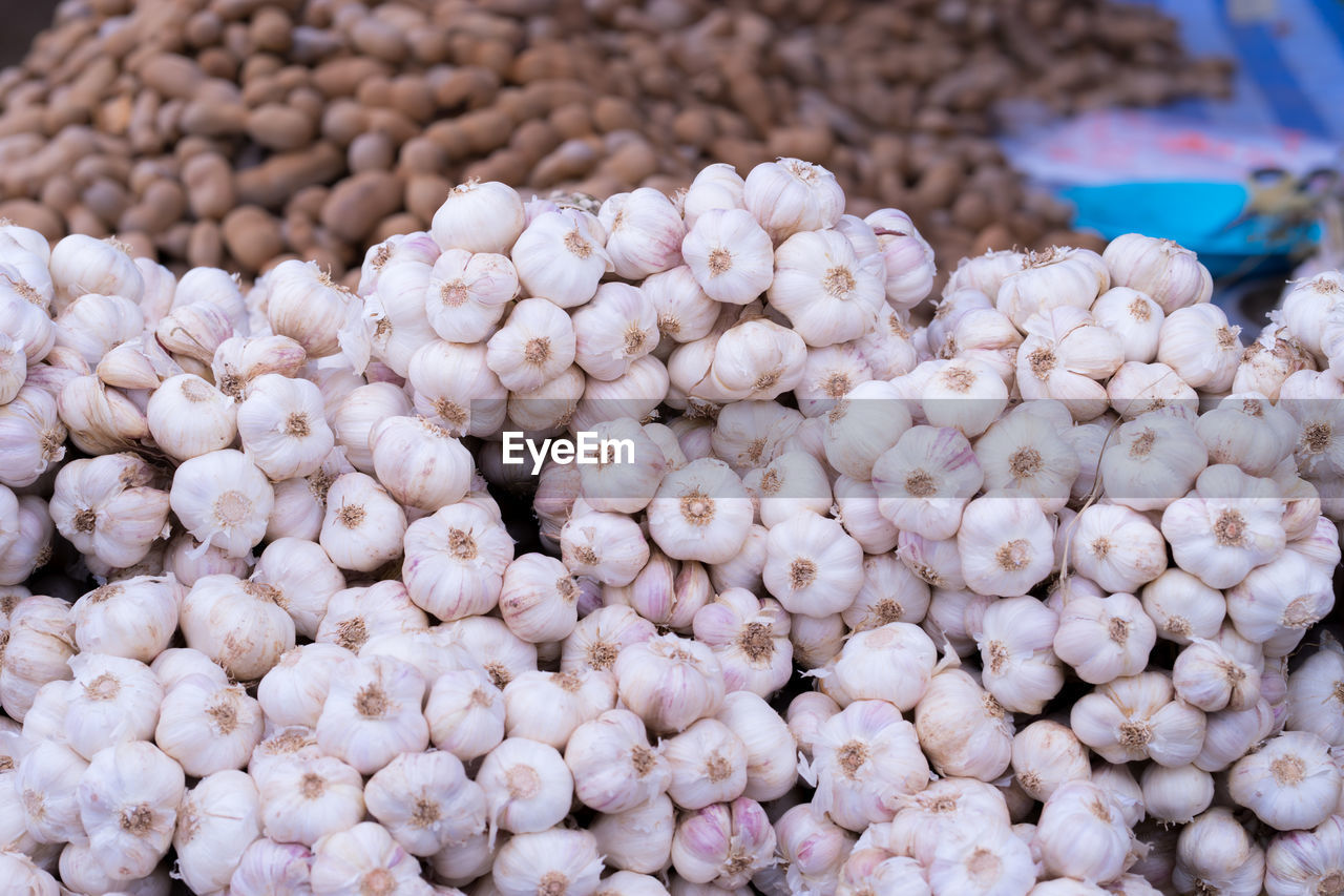 HIGH ANGLE VIEW OF FRUITS FOR SALE AT MARKET STALL