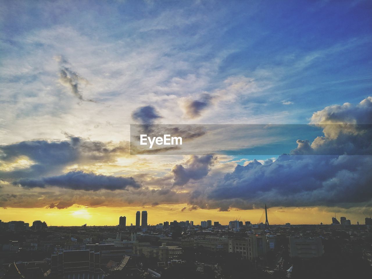 BUILDINGS AGAINST SKY DURING SUNSET