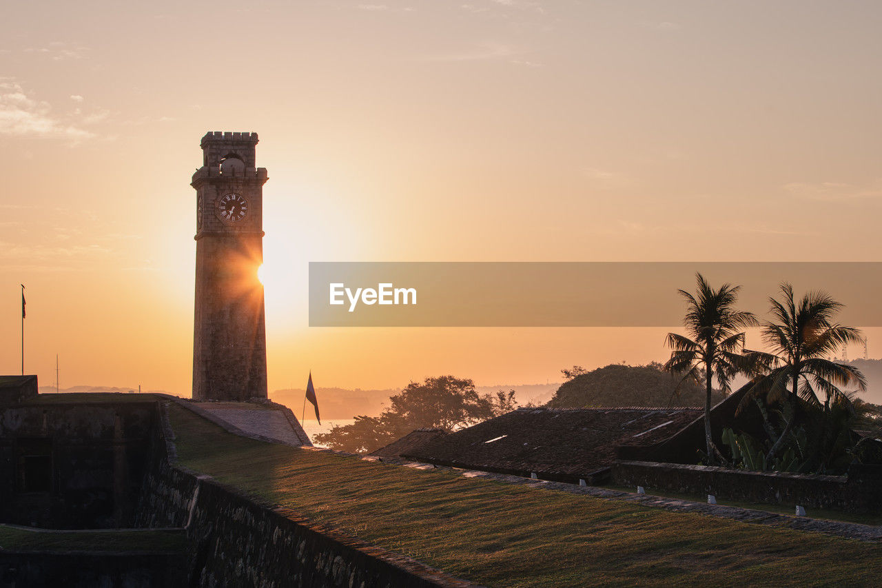 Clock tower in galle fort at beautiful sunrise. historical city in south coast of sri lanka.