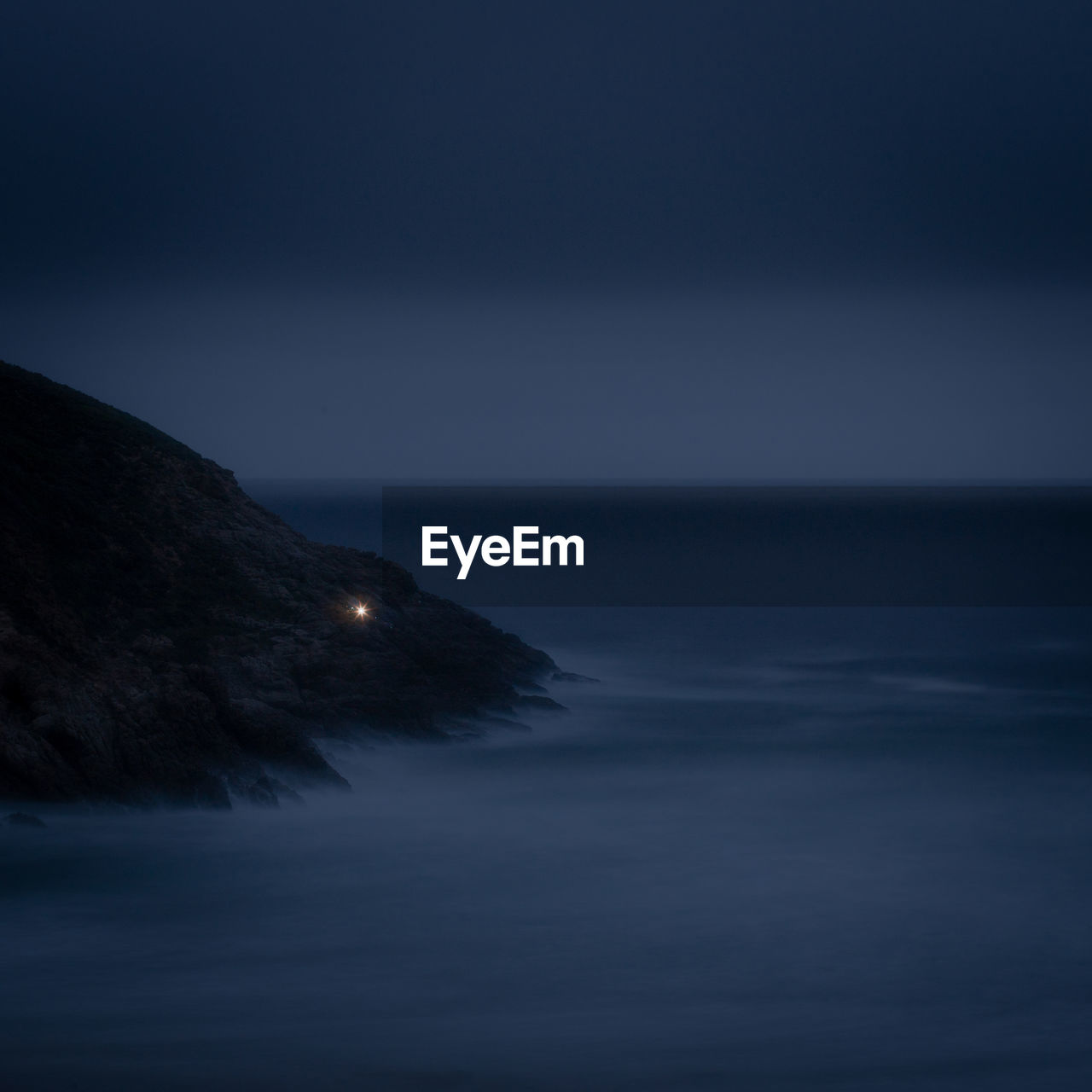 Scenic view of sea against clear sky at night