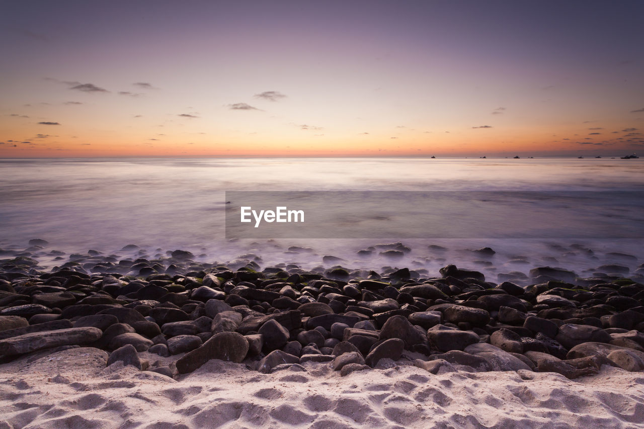 Scenic view of sea against sky during sunset