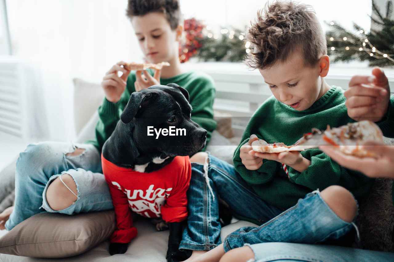 Friends sitting on a holding camera