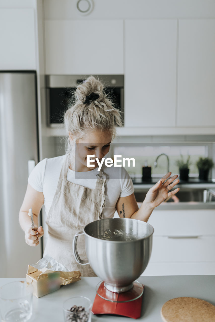 Smiling woman in kitchen