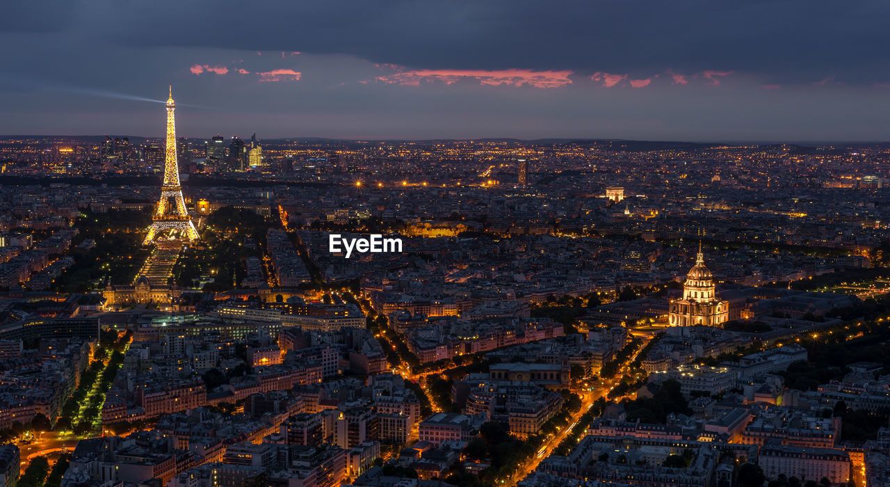 AERIAL VIEW OF ILLUMINATED CITYSCAPE