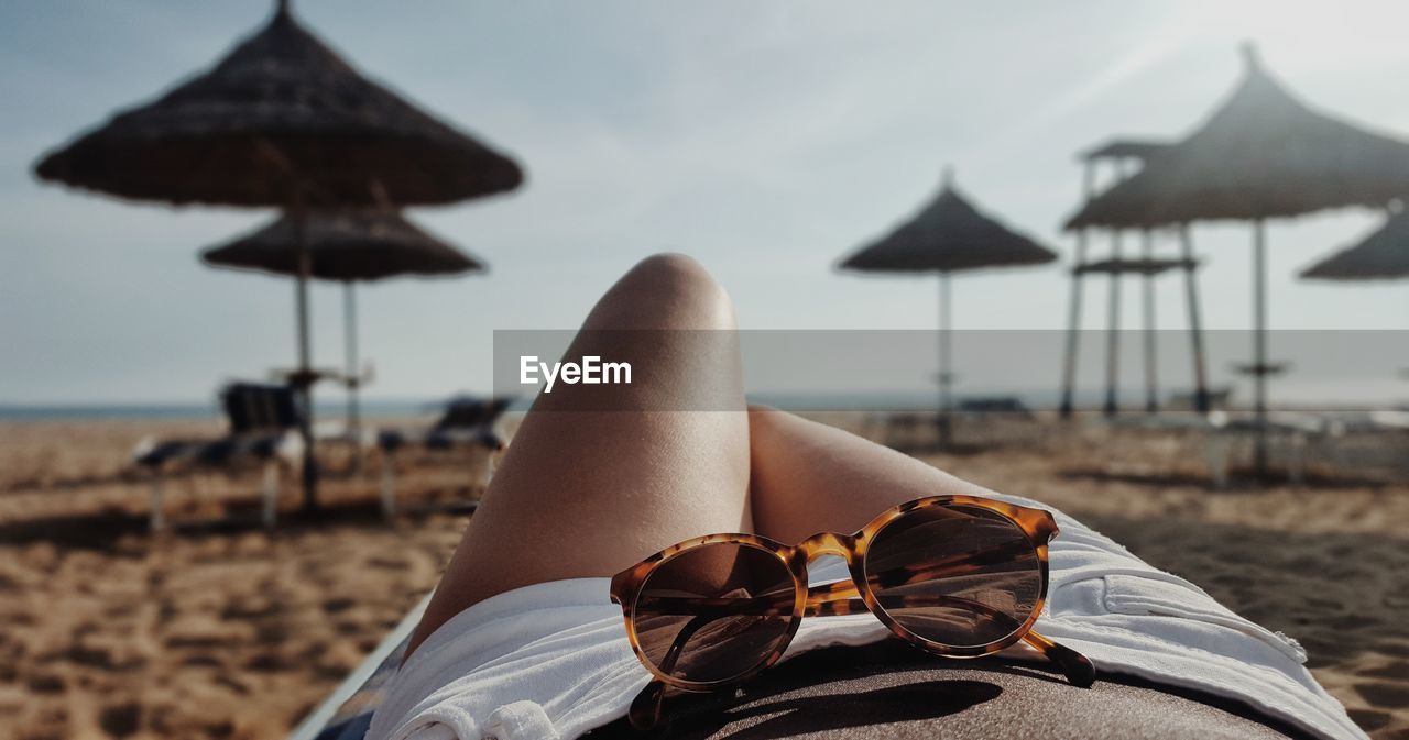 Low section of woman on beach