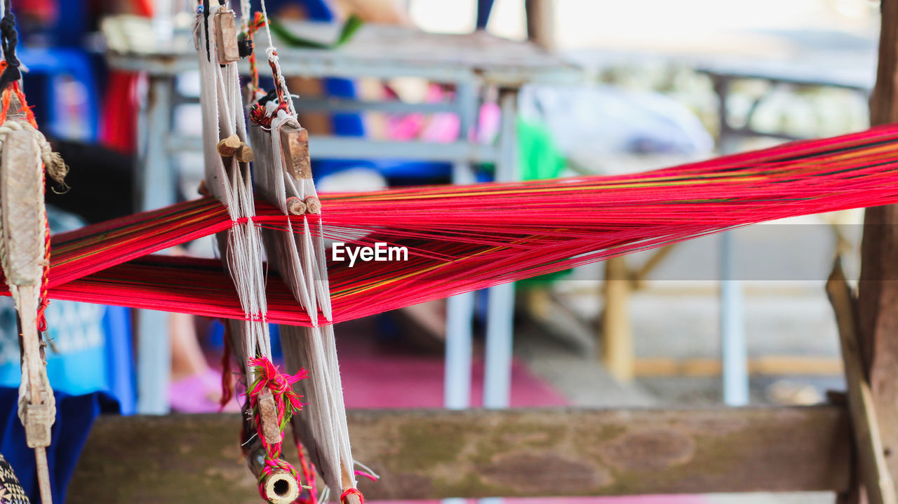 Close-up of red thread at factory