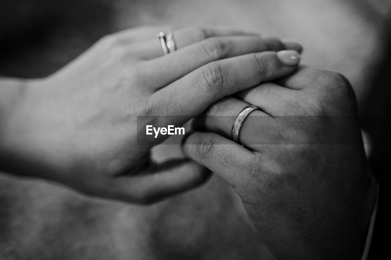 Close-up of couple holding hands