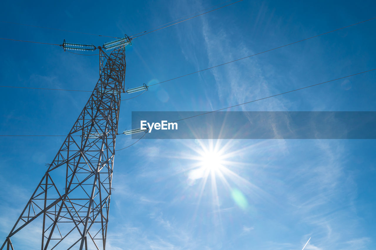 Electricity pylons in a mountain place. origin, transport and need for electricity. eletricity grid.