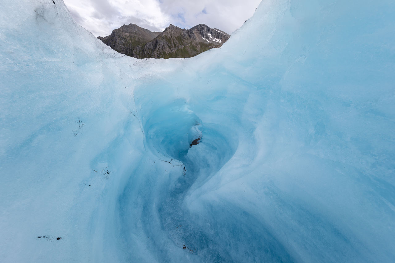 Ice cave against sky