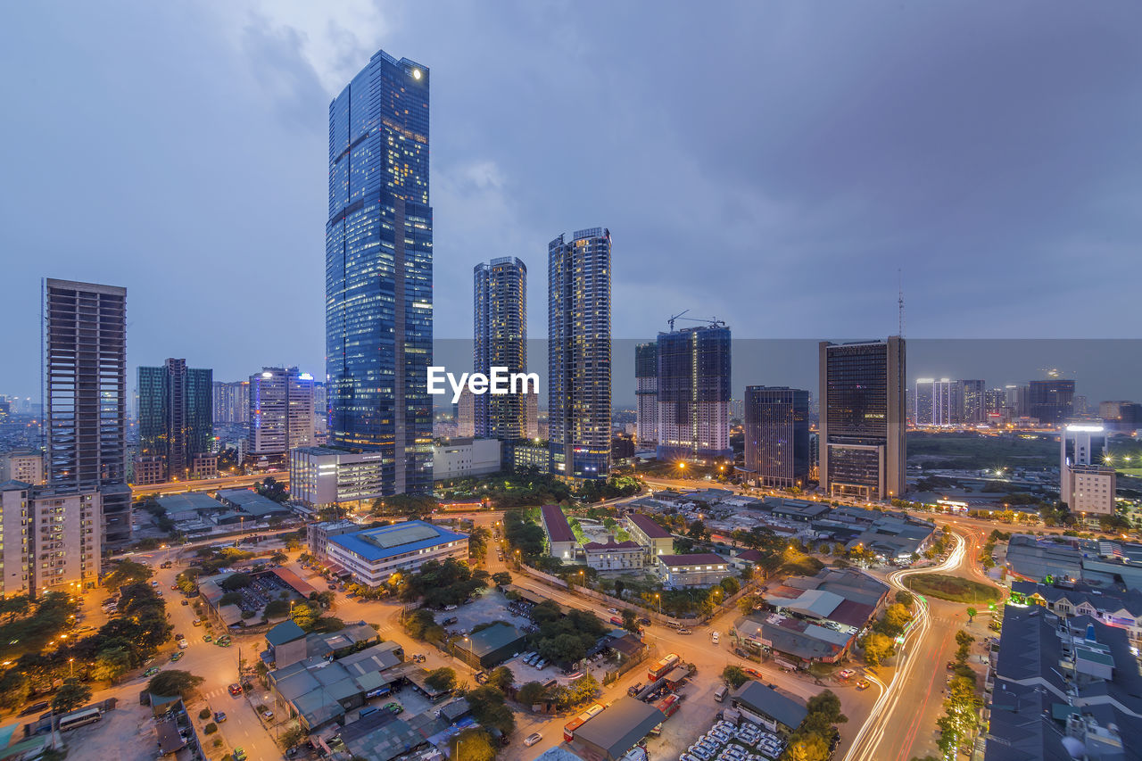 Aerial view of modern buildings in city against sky