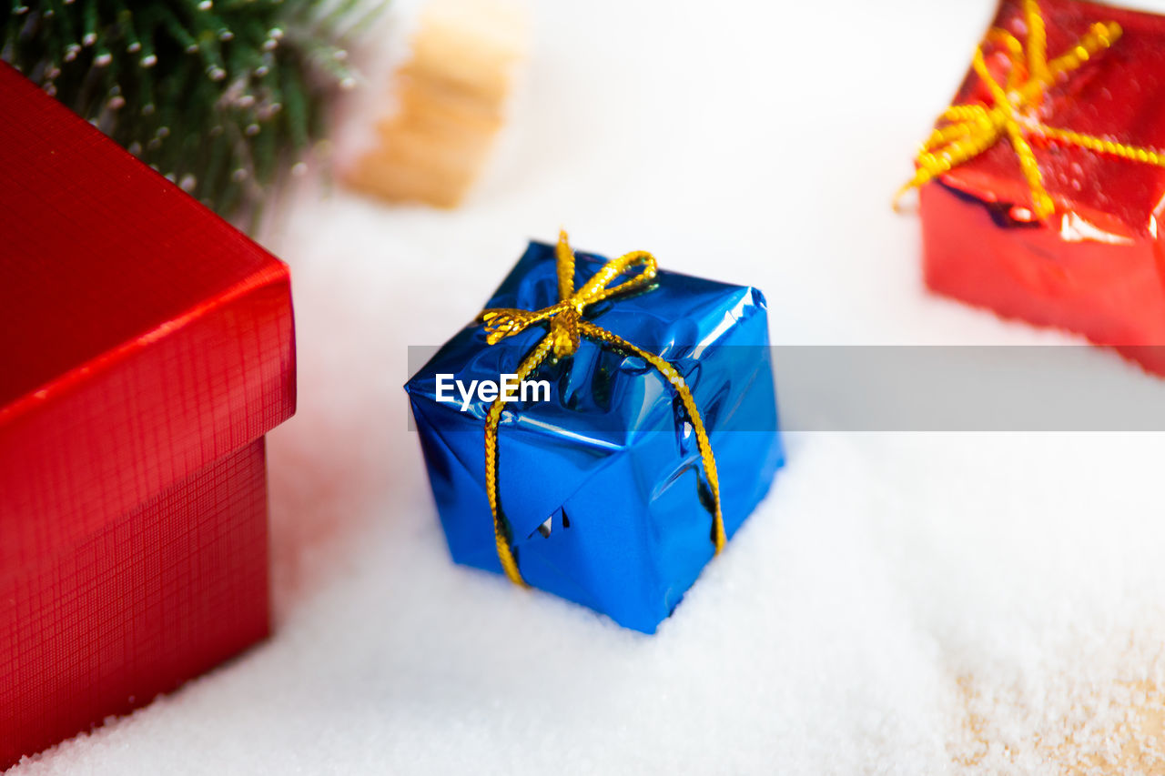 High angle view of christmas presents on fake snow