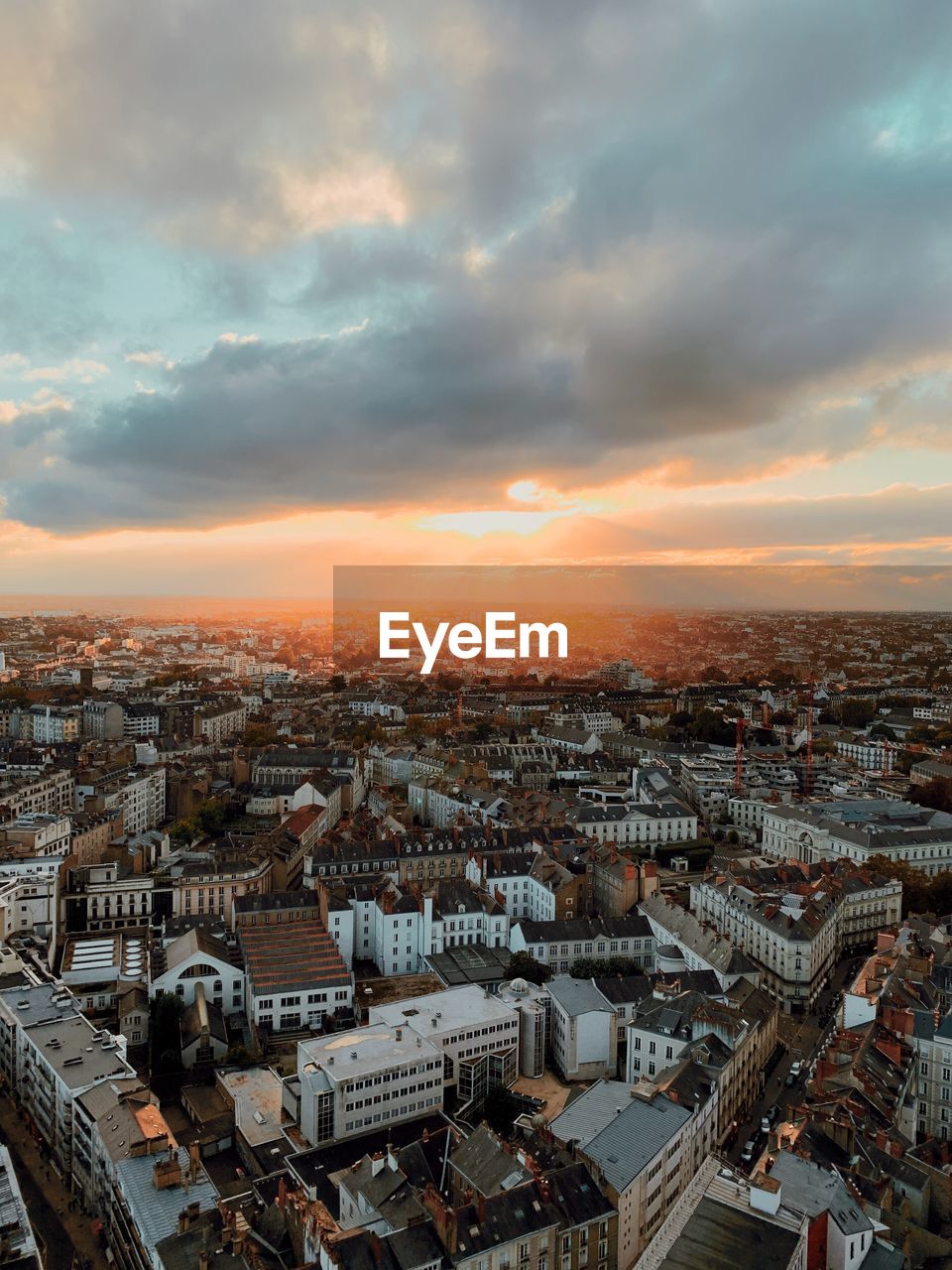 High angle view of city against sky during sunset