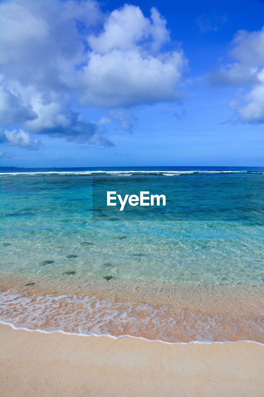 Scenic view of sea against blue sky