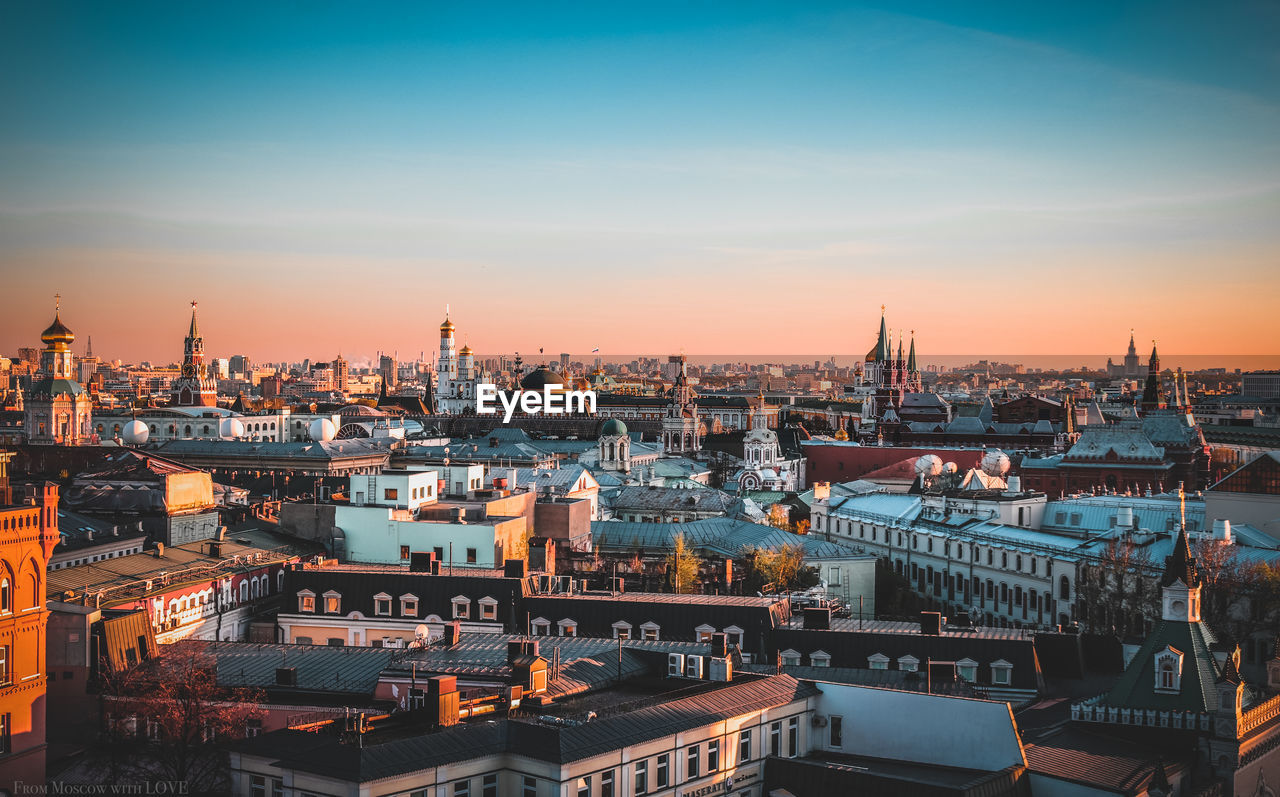 Cityscape against sky during sunset