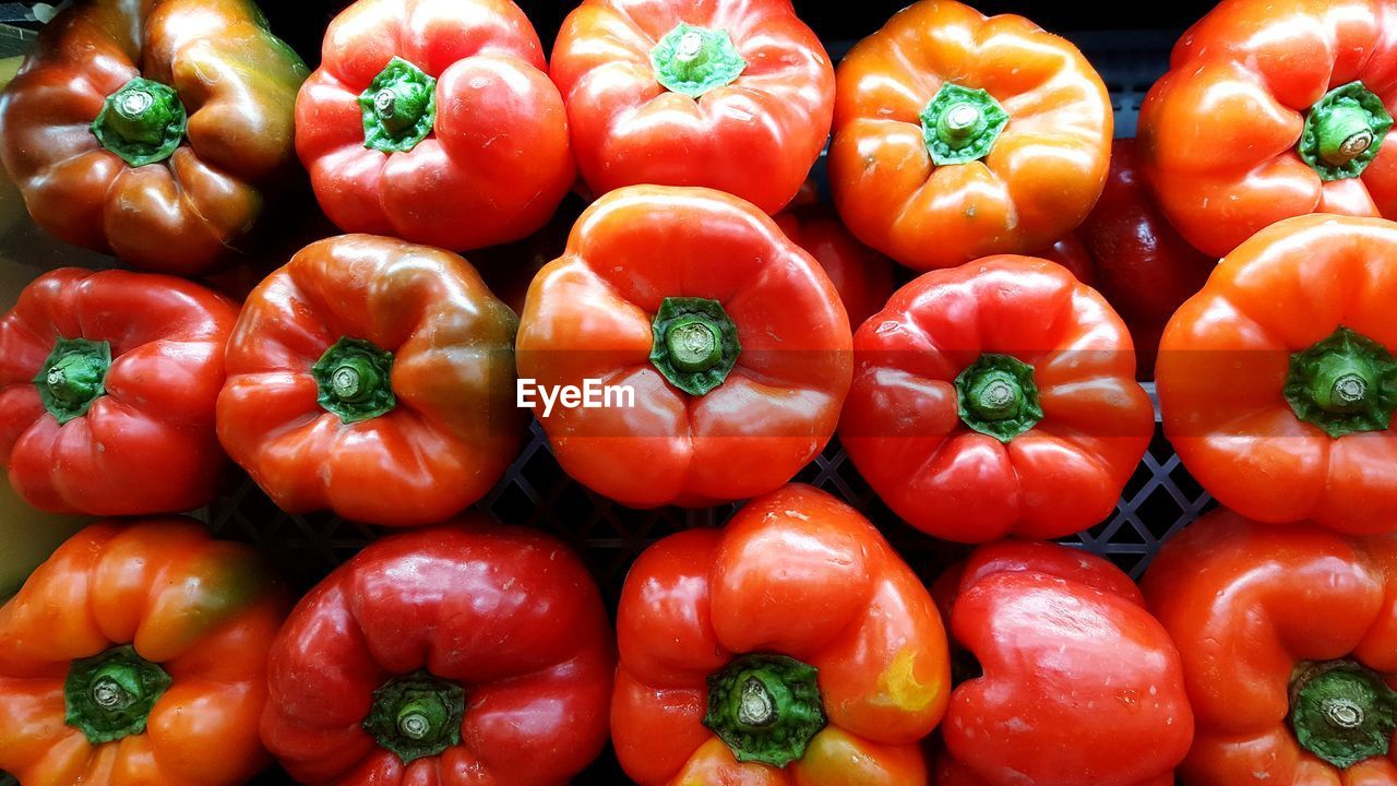 Full frame shot of red bell peppers at market for sale