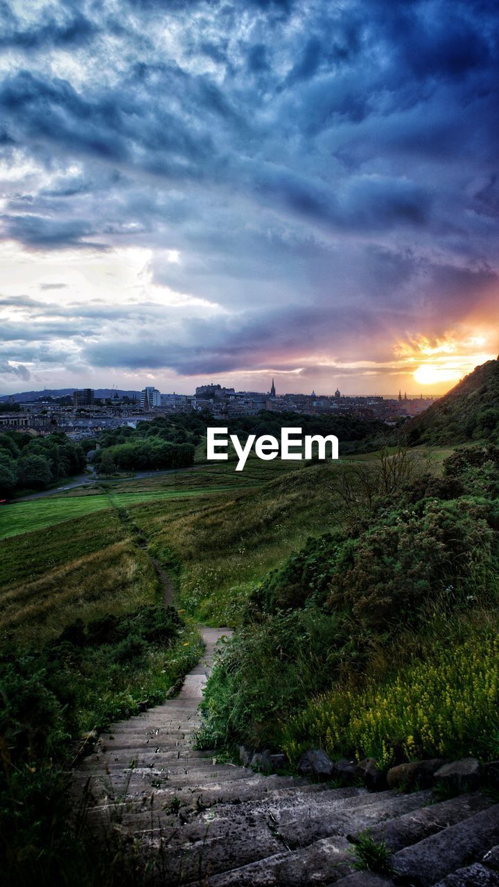 SCENIC VIEW OF LAND DURING SUNSET