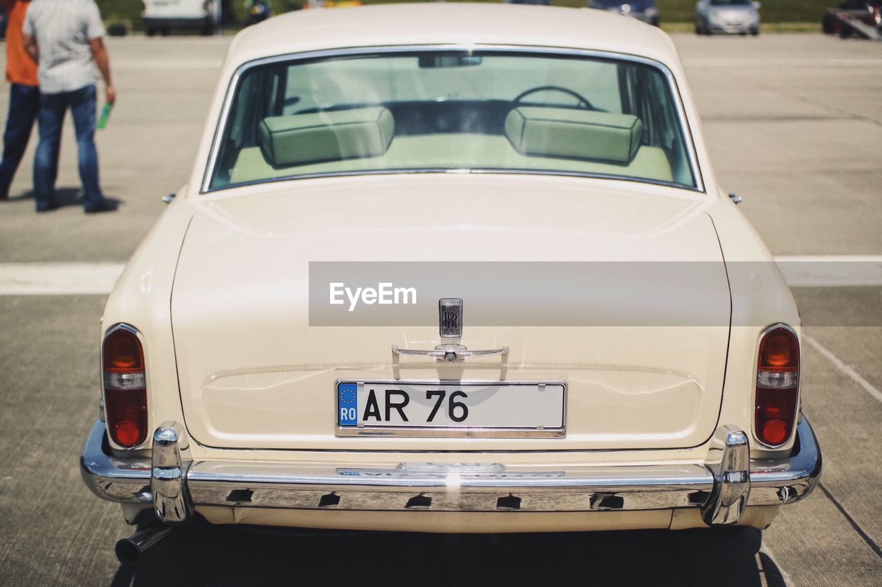 CLOSE-UP OF VINTAGE CAR ON BUS