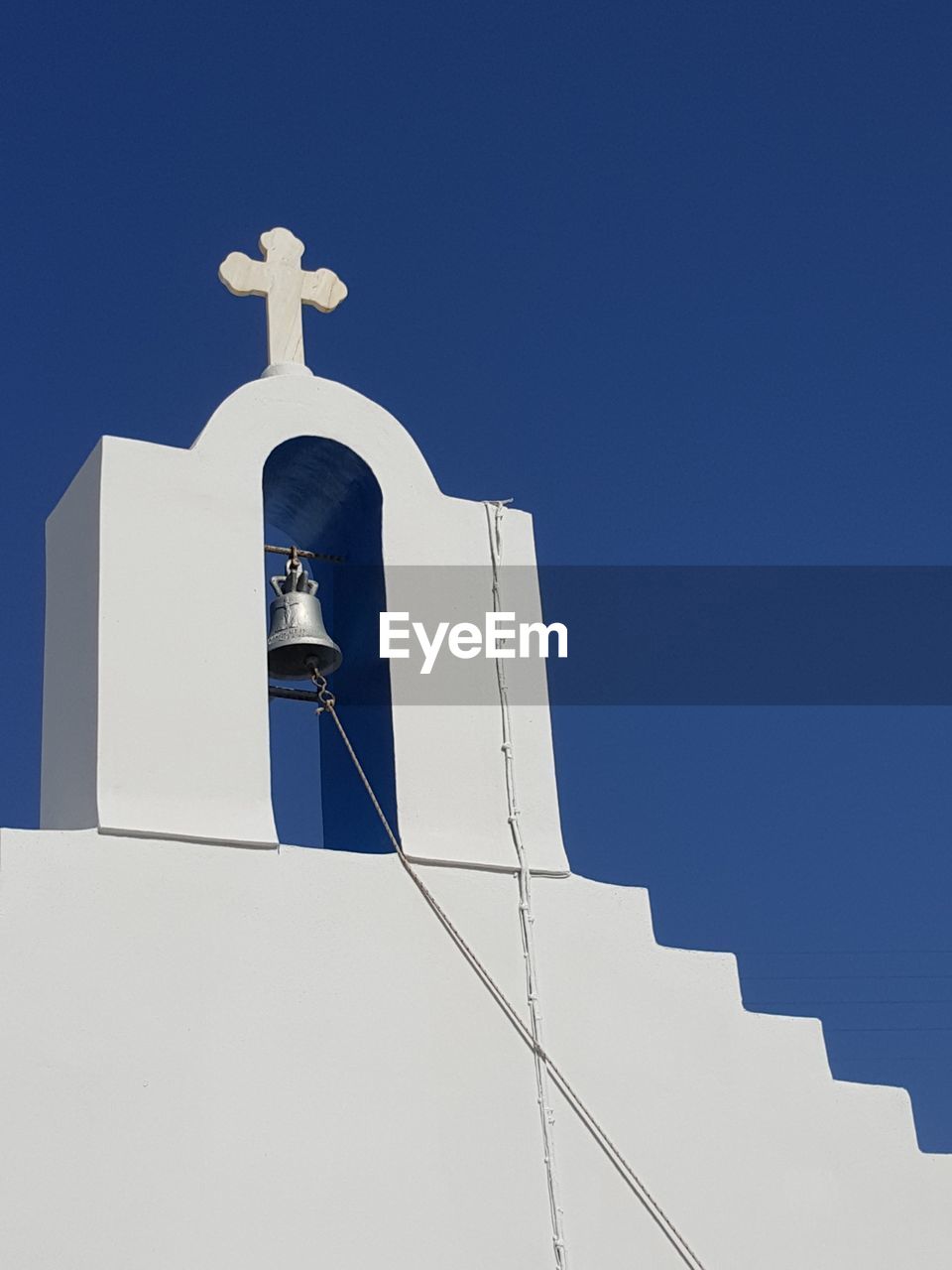 Low angle view of church against sky during sunny day