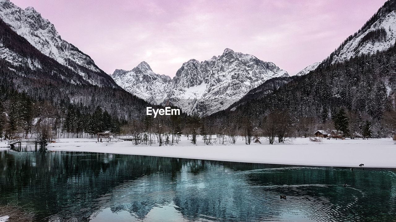 Scenic view of snowcapped mountains and lake against sky