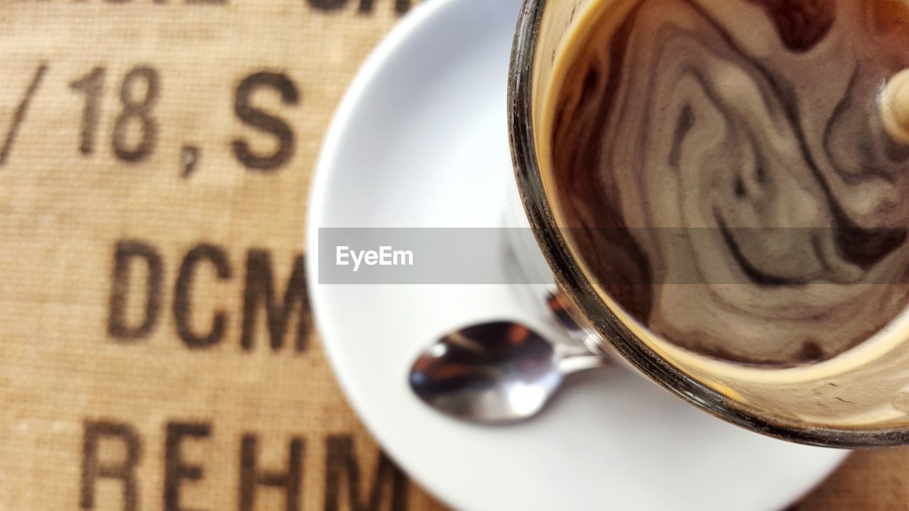 Close-up of coffee cup on table