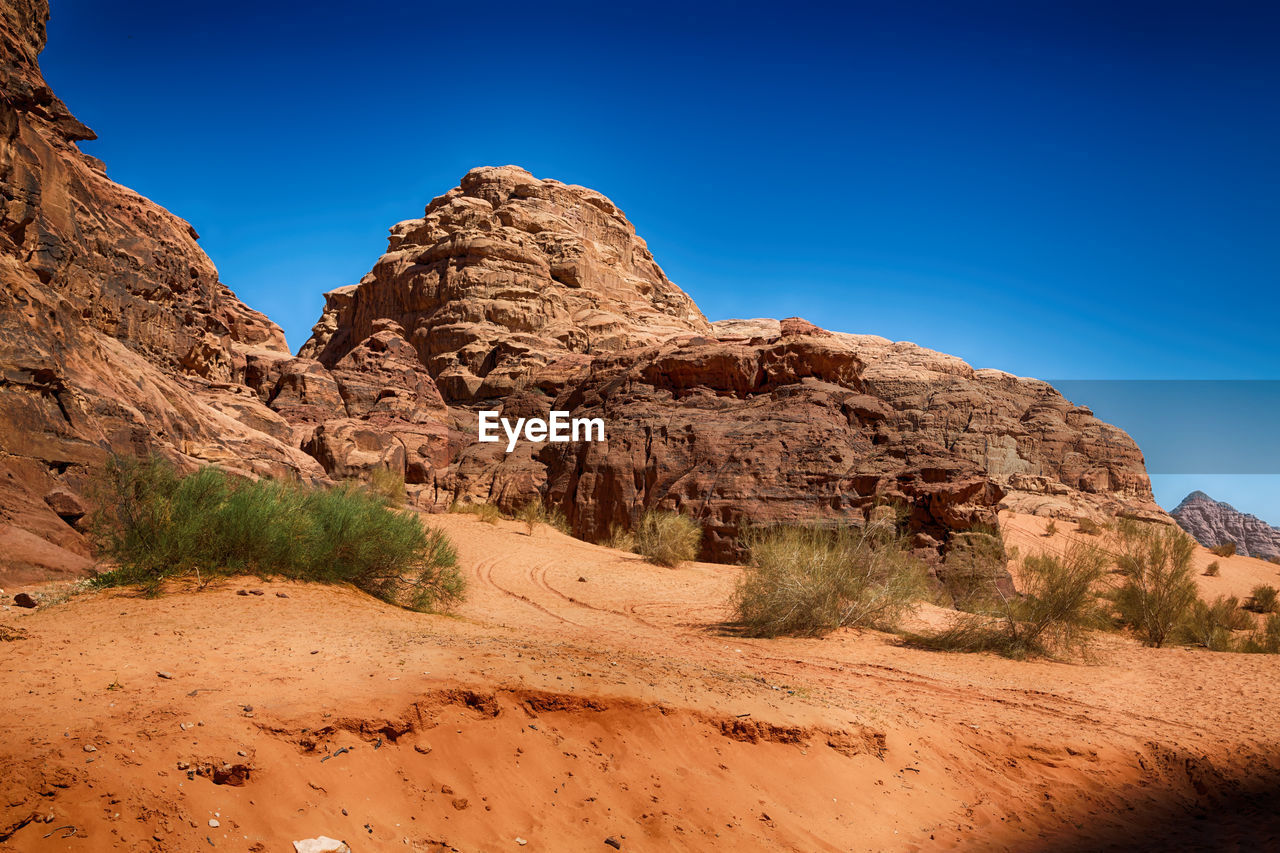 Rock formations on landscape against clear sky