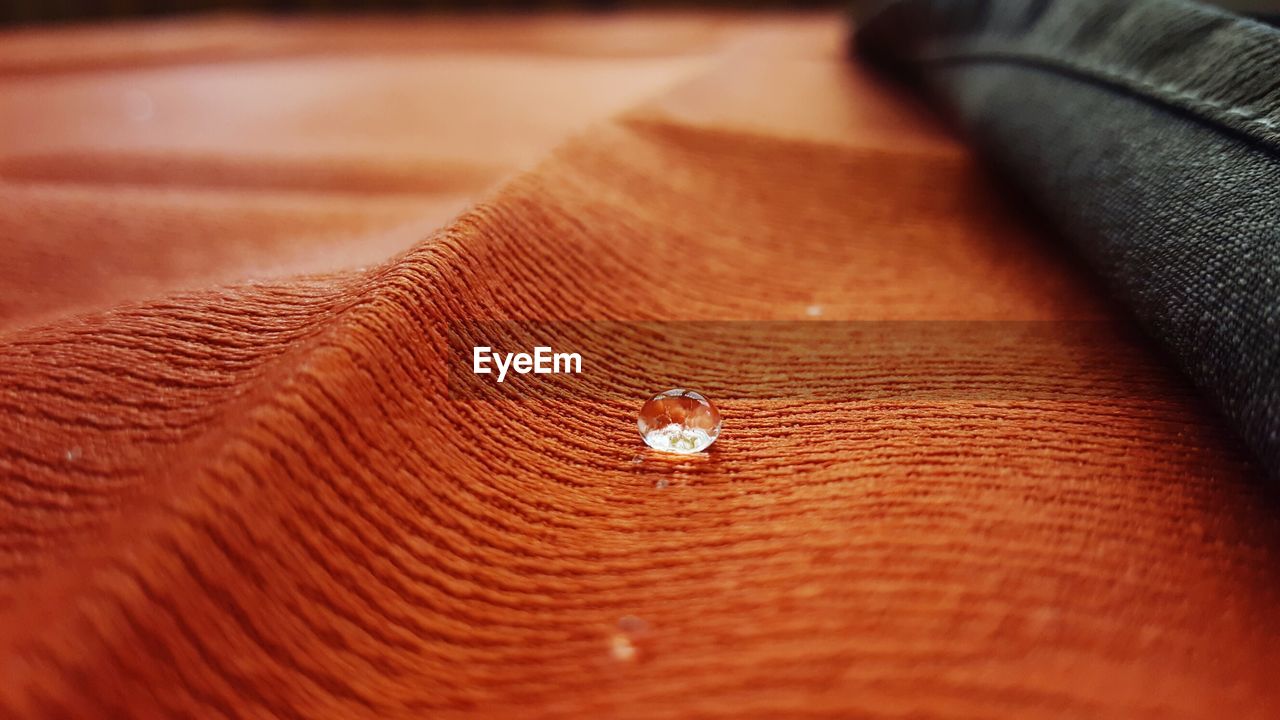Close-up of drops on table